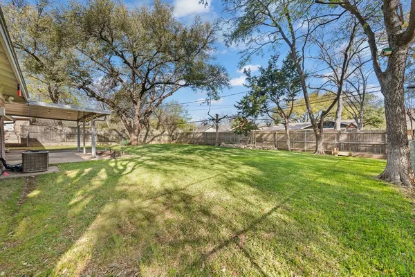 a view of yard with swimming pool
