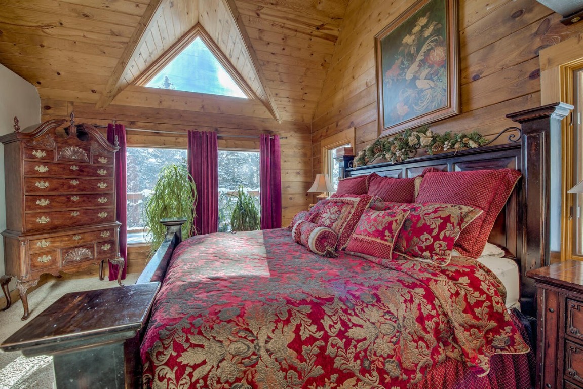 229 Lee Lane Breckenridge, CO 80424 - Photo 16 of 49 a large bed sitting in a bedroom next to a window