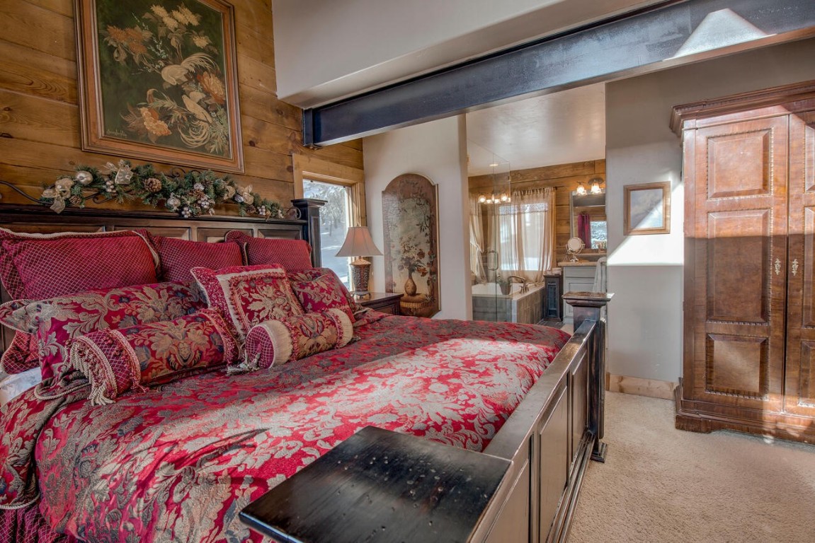 229 Lee Lane Breckenridge, CO 80424 - Photo 17 of 49 a bedroom with a large bed and a dresser