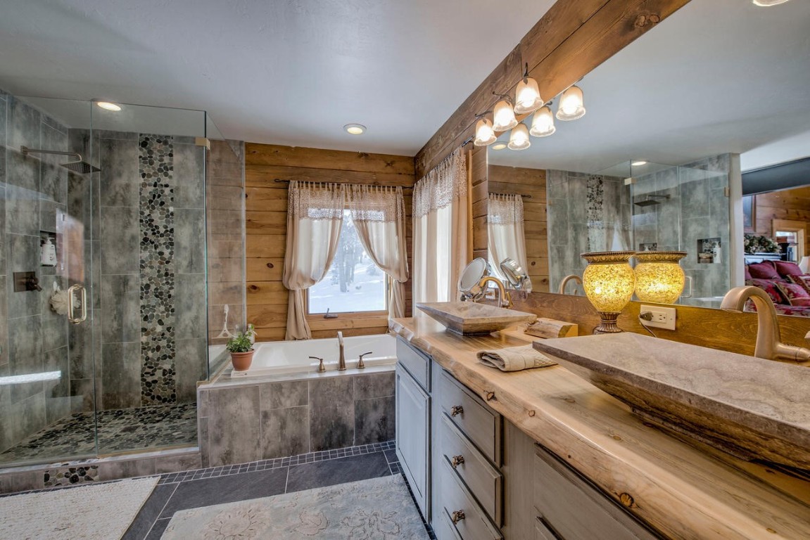229 Lee Lane Breckenridge, CO 80424 - Photo 20 of 49 a bathroom with a granite countertop sink and a mirror