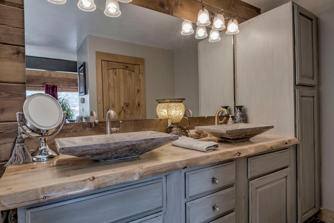 229 Lee Lane Breckenridge, CO 80424 - Photo 21 of 49 a bathroom with a granite countertop sink and a mirror