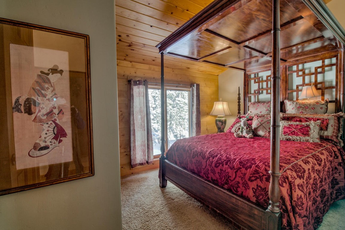 229 Lee Lane Breckenridge, CO 80424 - Photo 32 of 49 a bedroom with a large bed and a window