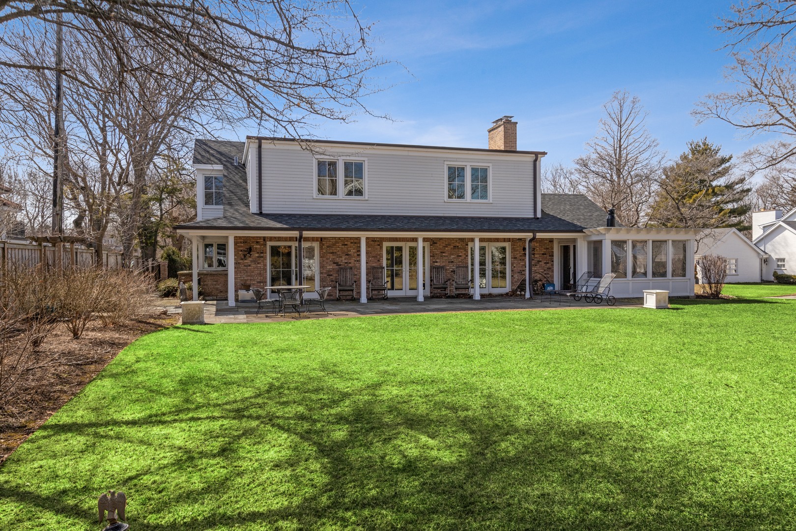 453 Sheridan Road Winnetka, IL 60093 - Photo 9 of 15 a front view of a house with yard