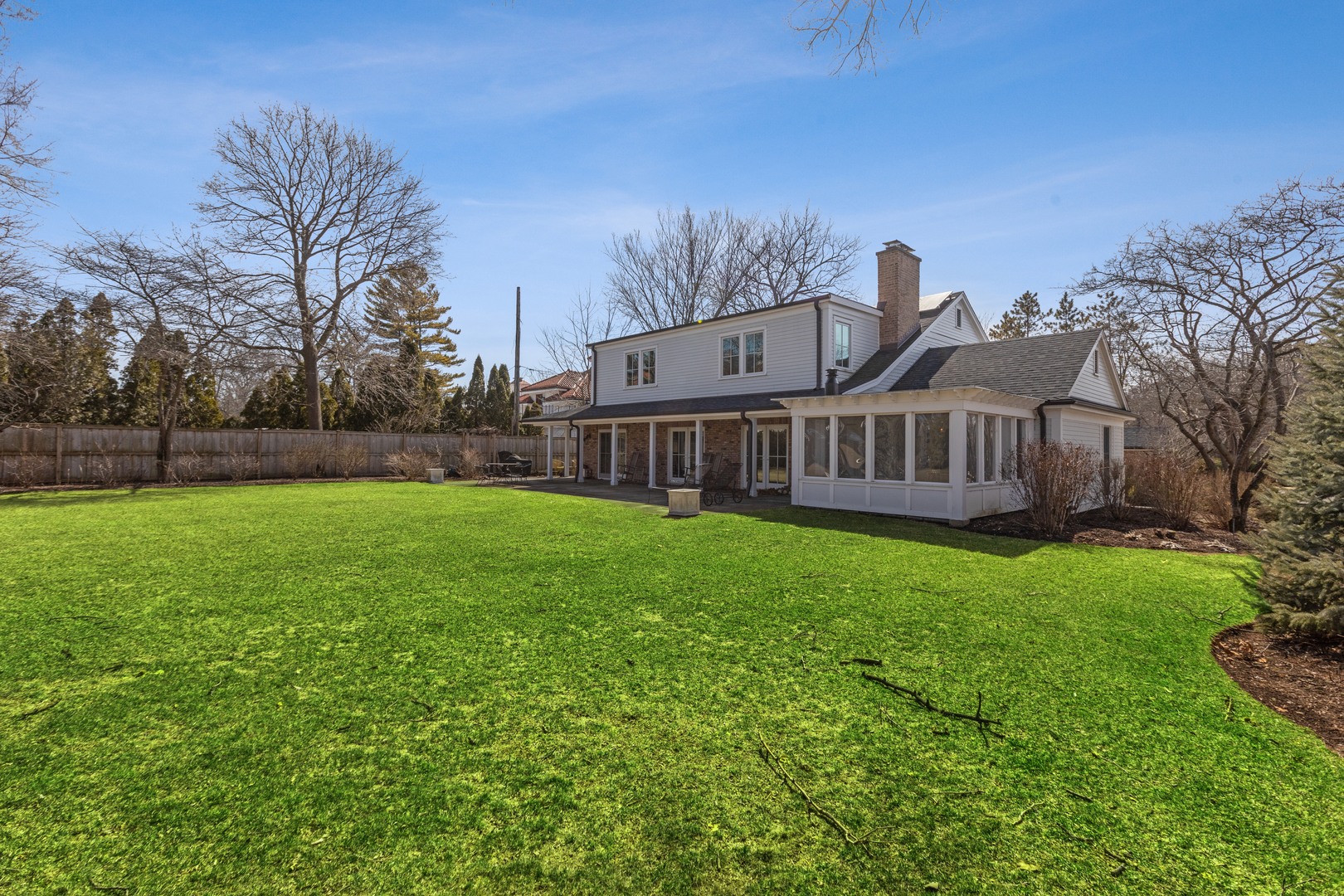 453 Sheridan Road Winnetka, IL 60093 - Photo 10 of 15 a view of a house with backyard and garden