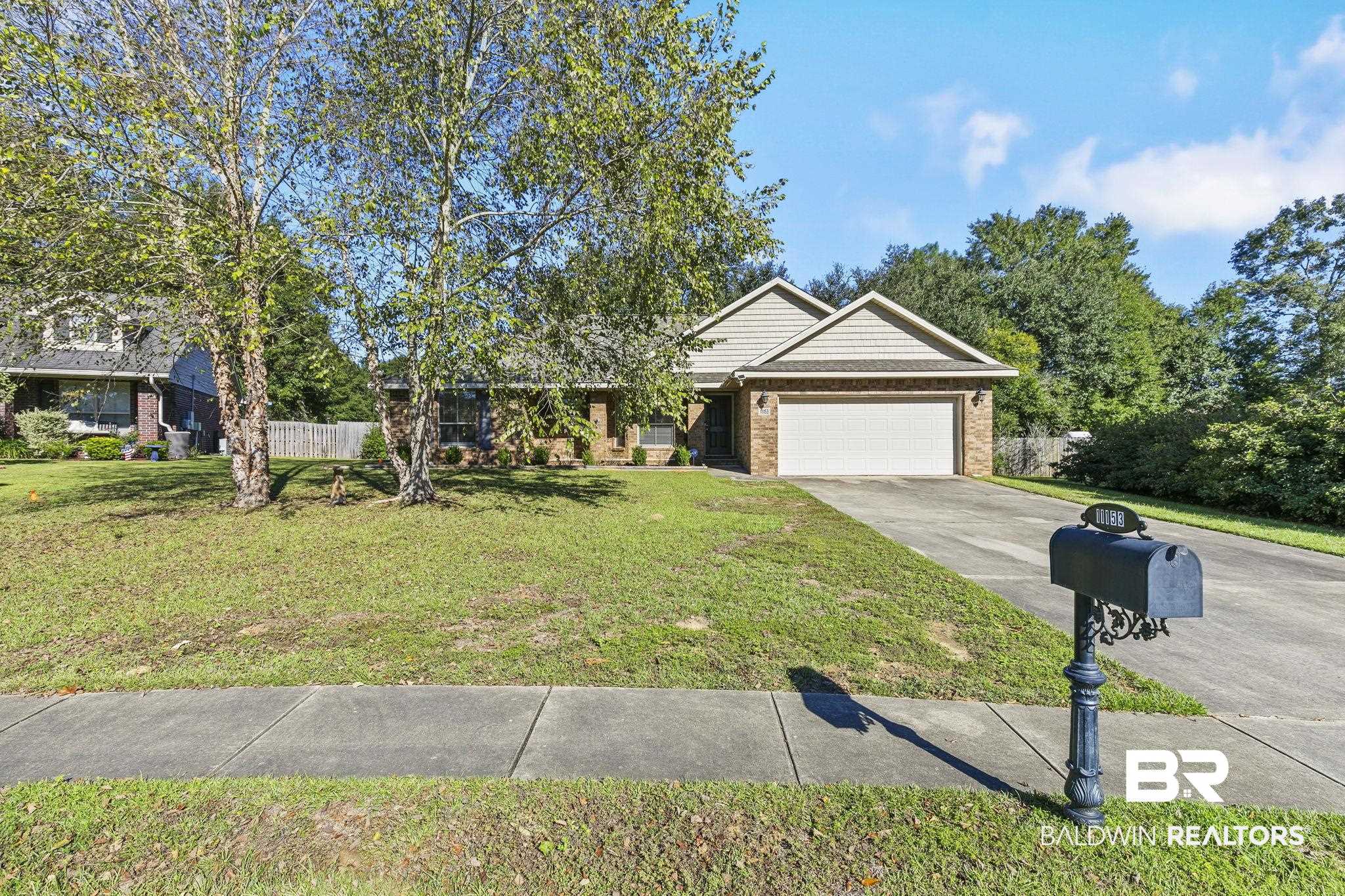 11153 Sturbridge Loop Daphne, AL 36526 - Photo 2 of 79 View of front facade featuring a garage and a front yard