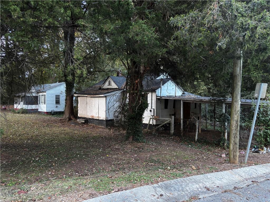 2402 Clifton Springs Road Decatur, GA 30034 - Photo 2 of 3 a view of a house with a yard and wooden fence