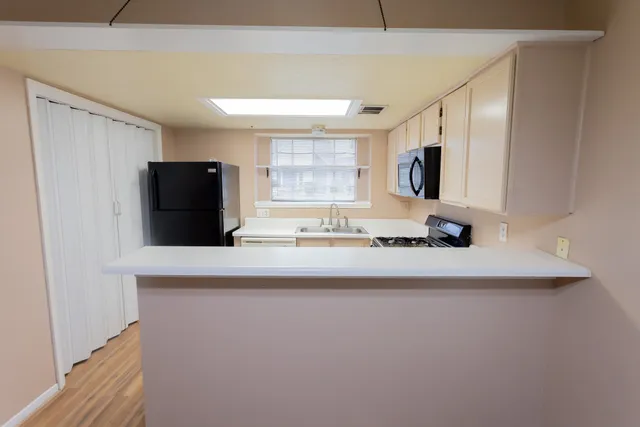 a bathroom with a sink a mirror and a shower