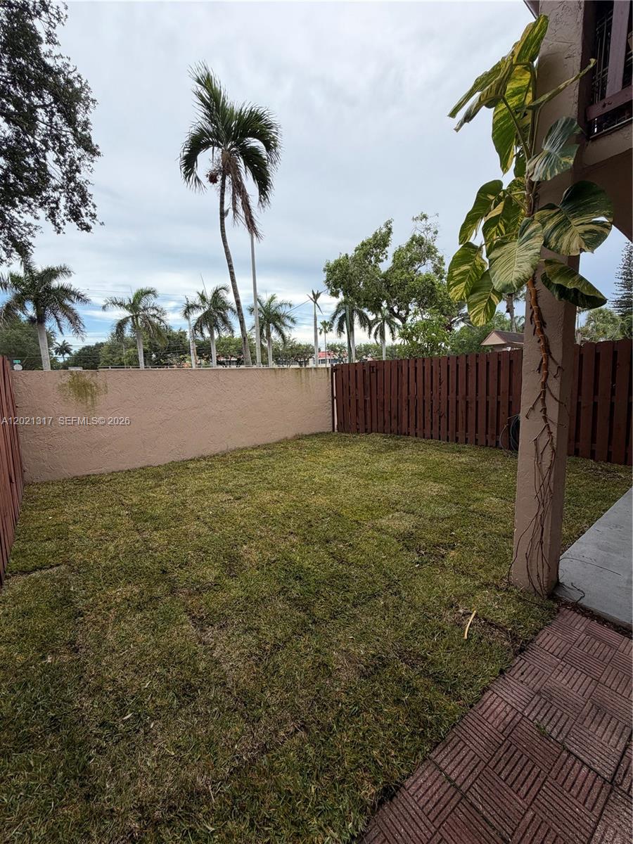 11201 Southwest 88th Street, Unit 102A Miami, FL 33173 - Photo 11 of 12 a view of a yard