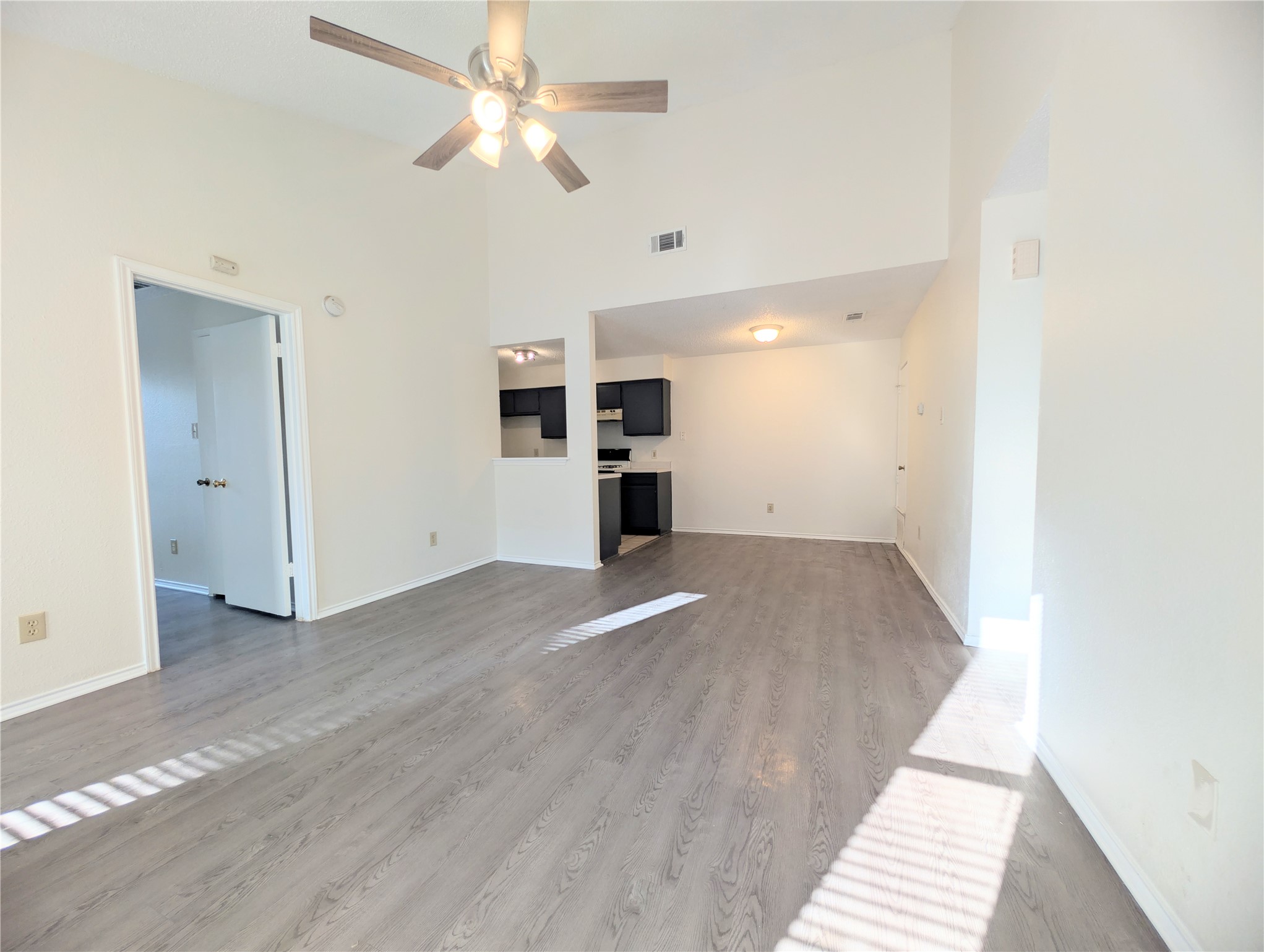 2016 Redwing Way Round Rock, TX 78664 - Photo 3 of 19 The generously proportioned living space with vaulted ceilings flows effortlessly into the kitchen.