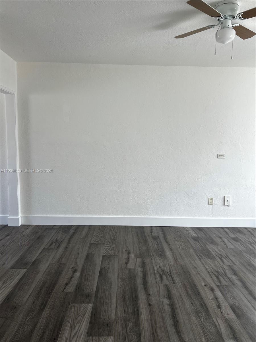 650 83rd Street, Unit 1 Miami Beach, FL 33141 - Photo 37 of 37 a view of an empty room and wooden floor