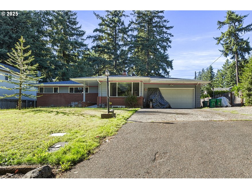 205 Northeast 160th Avenue Portland, OR 97230 - Photo 1 of 35 a view of a house with a yard and a garden