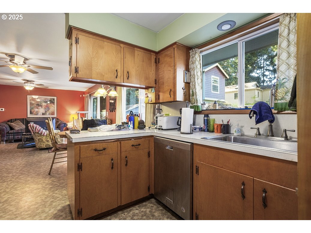 205 Northeast 160th Avenue Portland, OR 97230 - Photo 14 of 35 a kitchen with lots of counter top space and windows