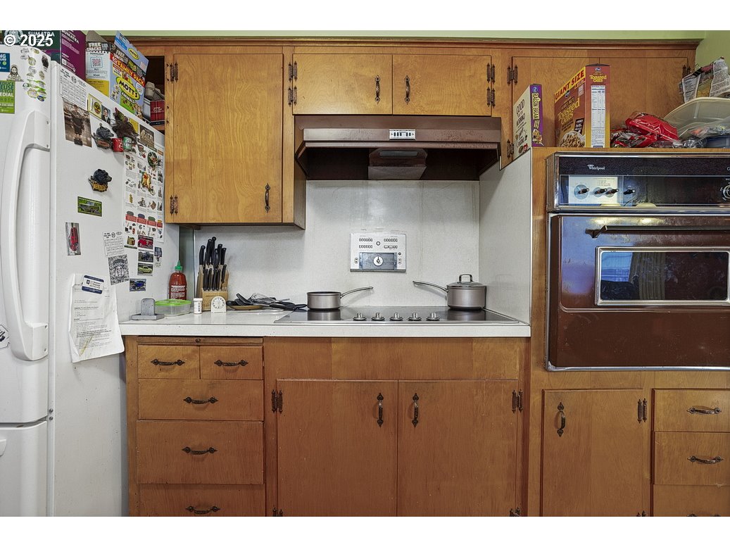 205 Northeast 160th Avenue Portland, OR 97230 - Photo 15 of 35 a kitchen with stainless steel appliances granite countertop a sink and a stove