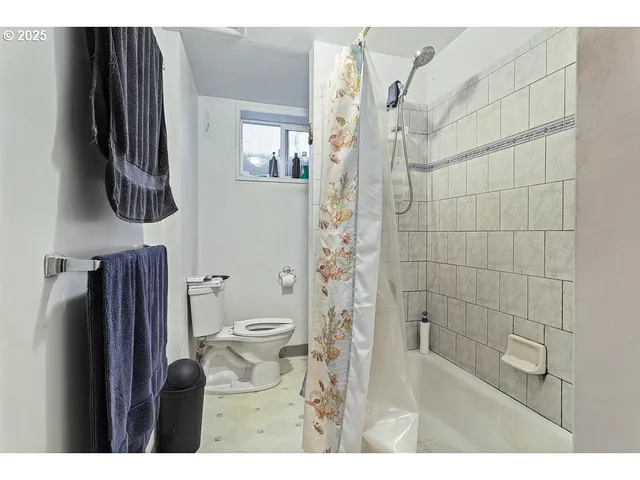 a bathroom with a sink mirror and toilet