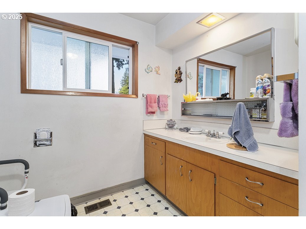 205 Northeast 160th Avenue Portland, OR 97230 - Photo 20 of 35 a bathroom with a sink and a mirror