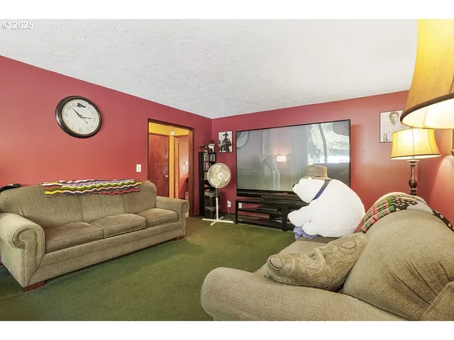 a room with lots of furniture and clutter