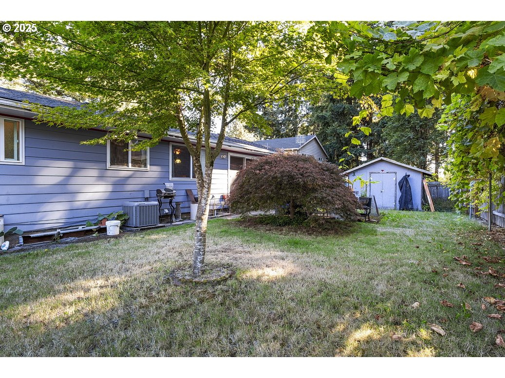 205 Northeast 160th Avenue Portland, OR 97230 - Photo 34 of 35 a view of a backyard with a large tree