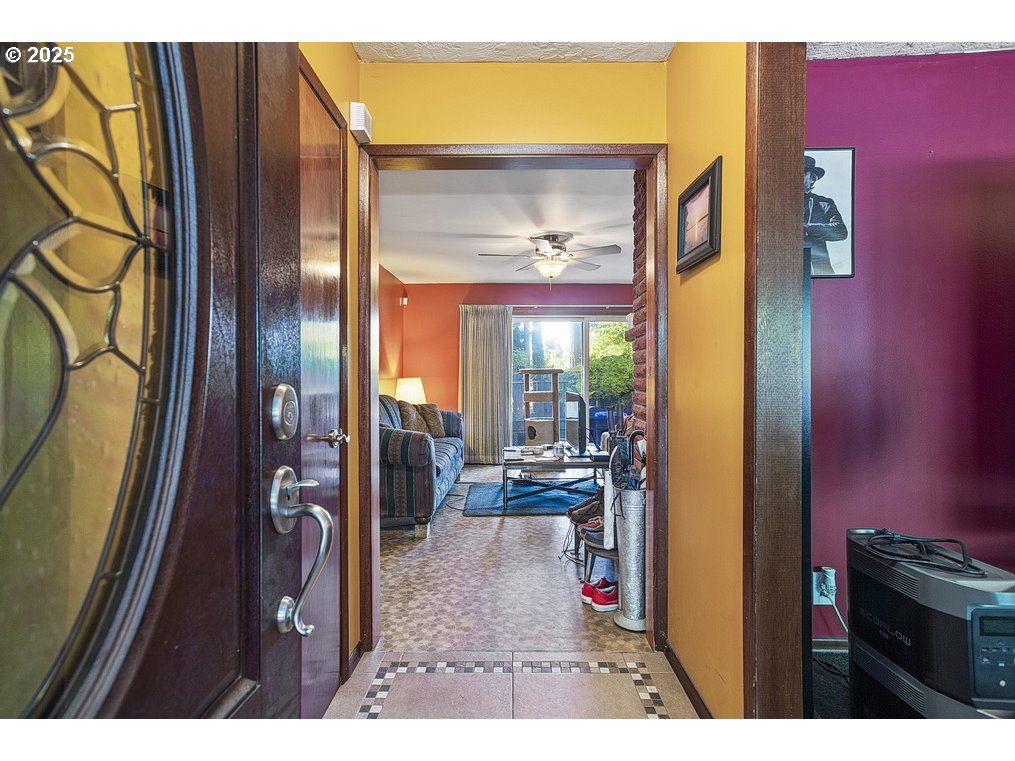 205 Northeast 160th Avenue Portland, OR 97230 - Photo 6 of 35 a picture of a living room with a fireplace furniture and a large window