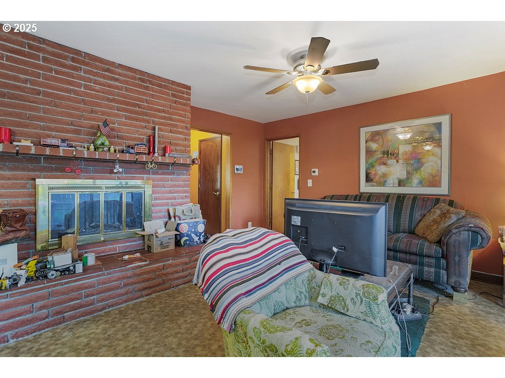 205 Northeast 160th Avenue Portland, OR 97230 - Photo 10 of 35 a bedroom with furniture and a chandelier
