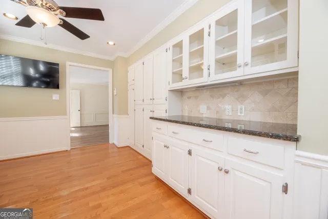a bathroom with a sink and a large mirror