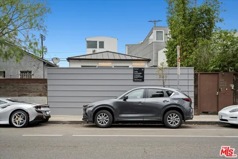 a view of a car in front of a house