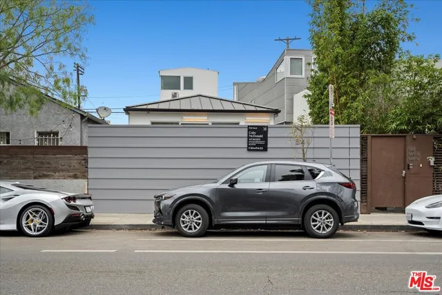 a view of a car in front of a house