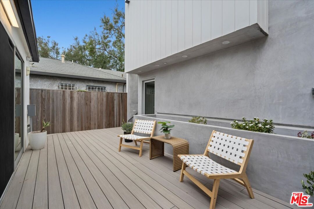 541 Rose Avenue, Unit LOFT Venice, CA 90291 - Photo 5 of 13 a balcony with furniture and wooden floor
