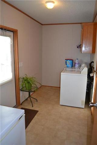 200 Fairview School Road Normandy, TN 37360 - Photo 7 of 14 Utility room with built-ins and access to the side deck.