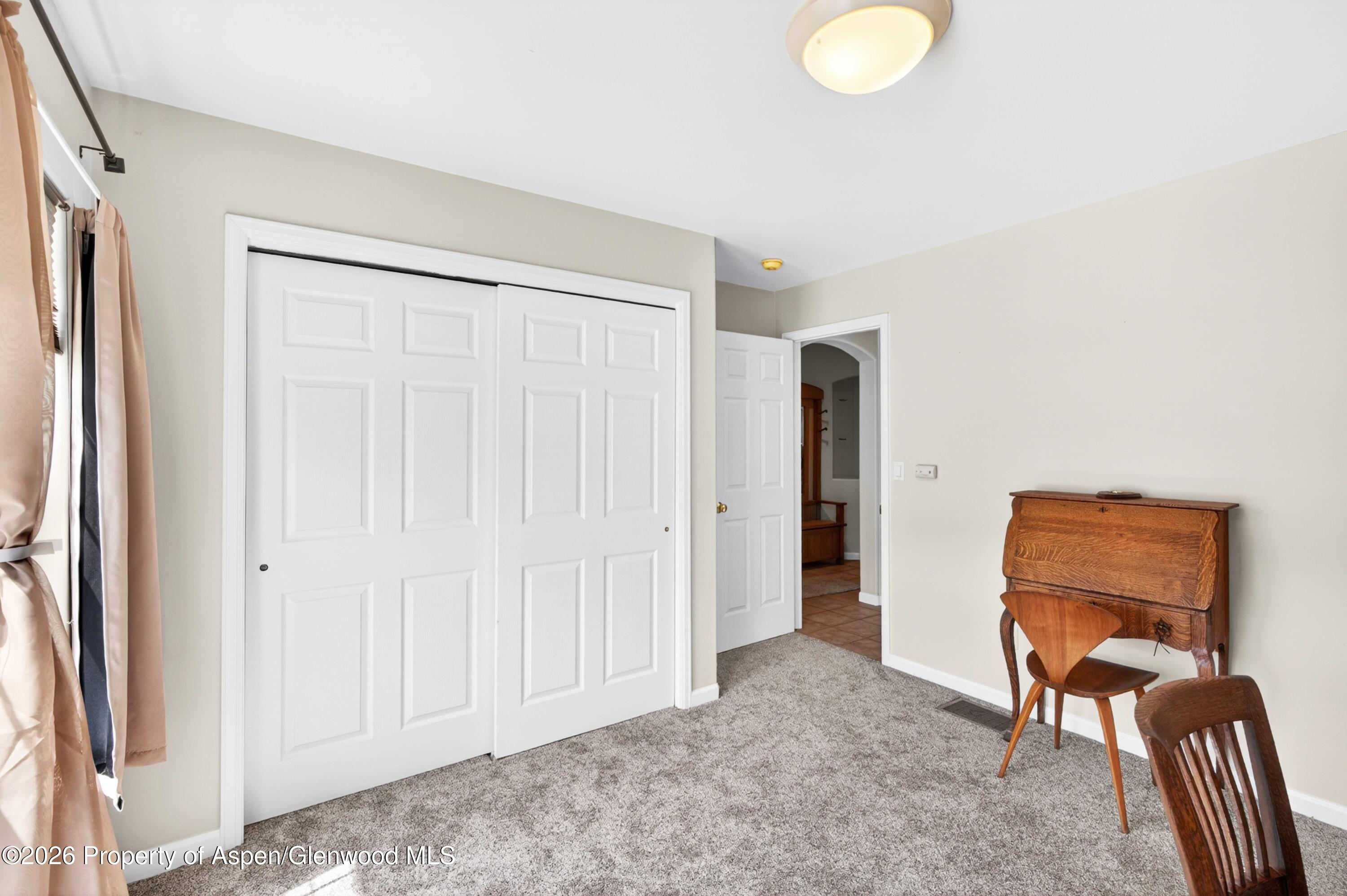 608 Lariat Loop New Castle, CO 81647 - Photo 22 of 32 a view of a livingroom with furniture and a window