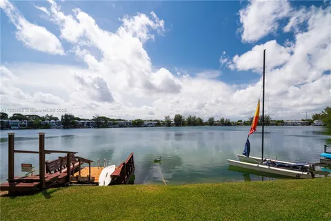 a view of a lake with a bench and lake view