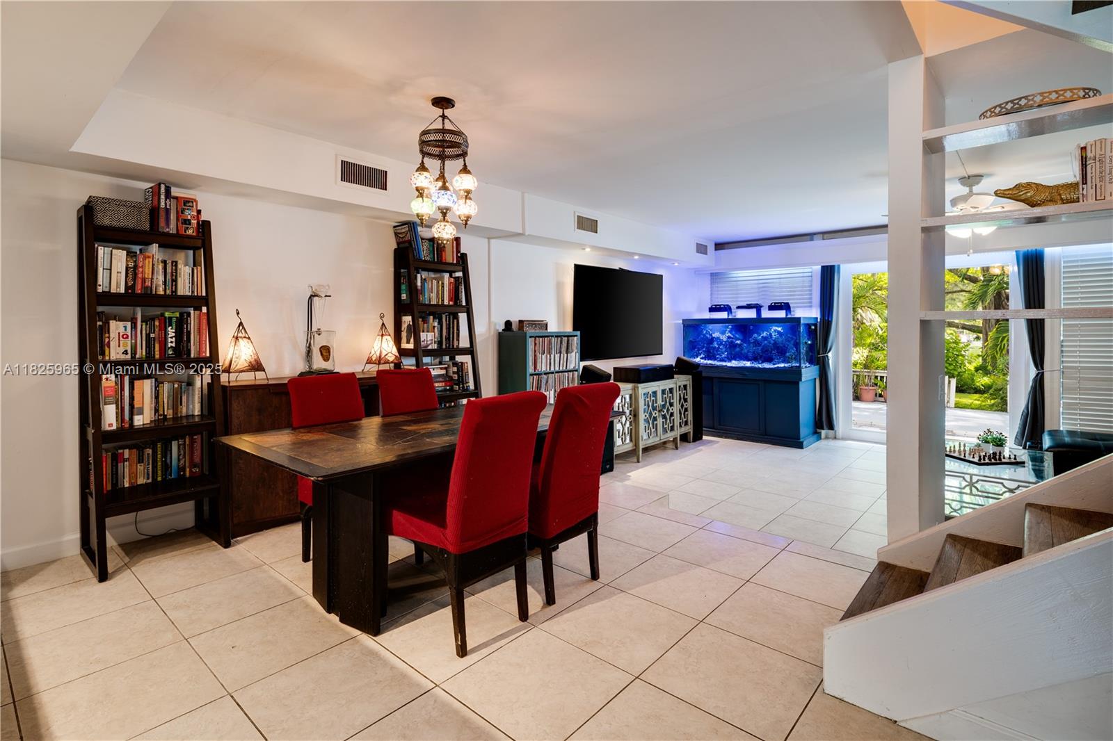 5292 Southwest 69th Place Miami, FL 33155 - Photo 12 of 37 a view of a livingroom with furniture and a flat screen tv