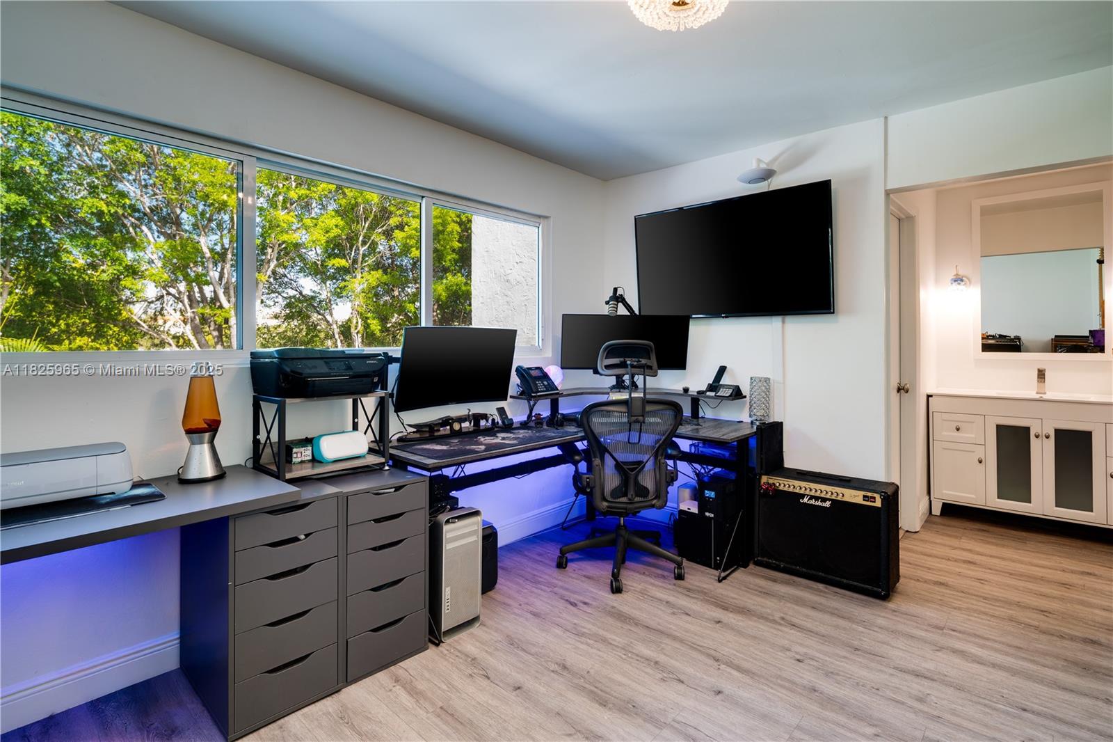 5292 Southwest 69th Place Miami, FL 33155 - Photo 21 of 37 a view of a workspace with furniture and a window