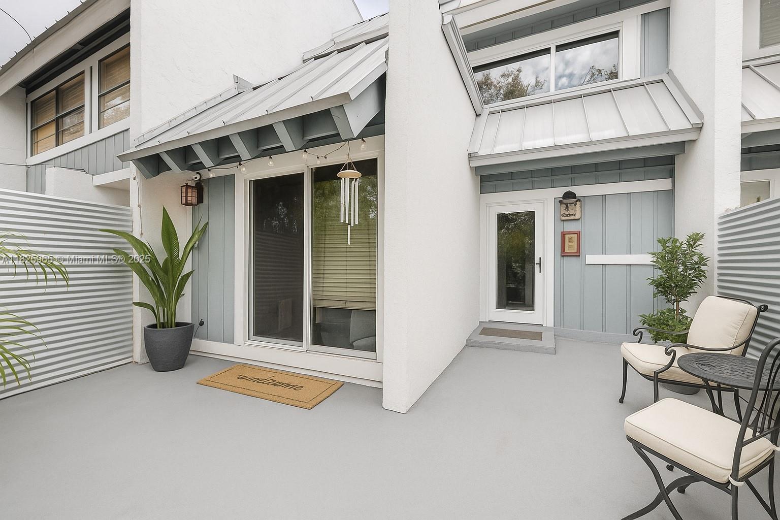 5292 Southwest 69th Place Miami, FL 33155 - Photo 23 of 37 a view of a chair and table in the back yard of the house