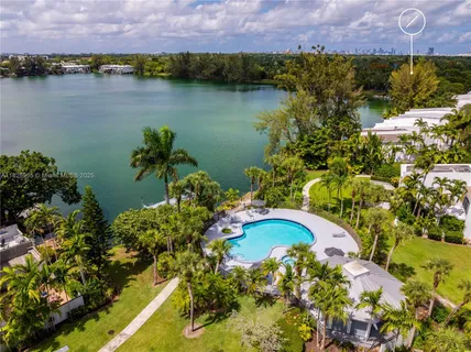 an aerial view of a house with a lake view
