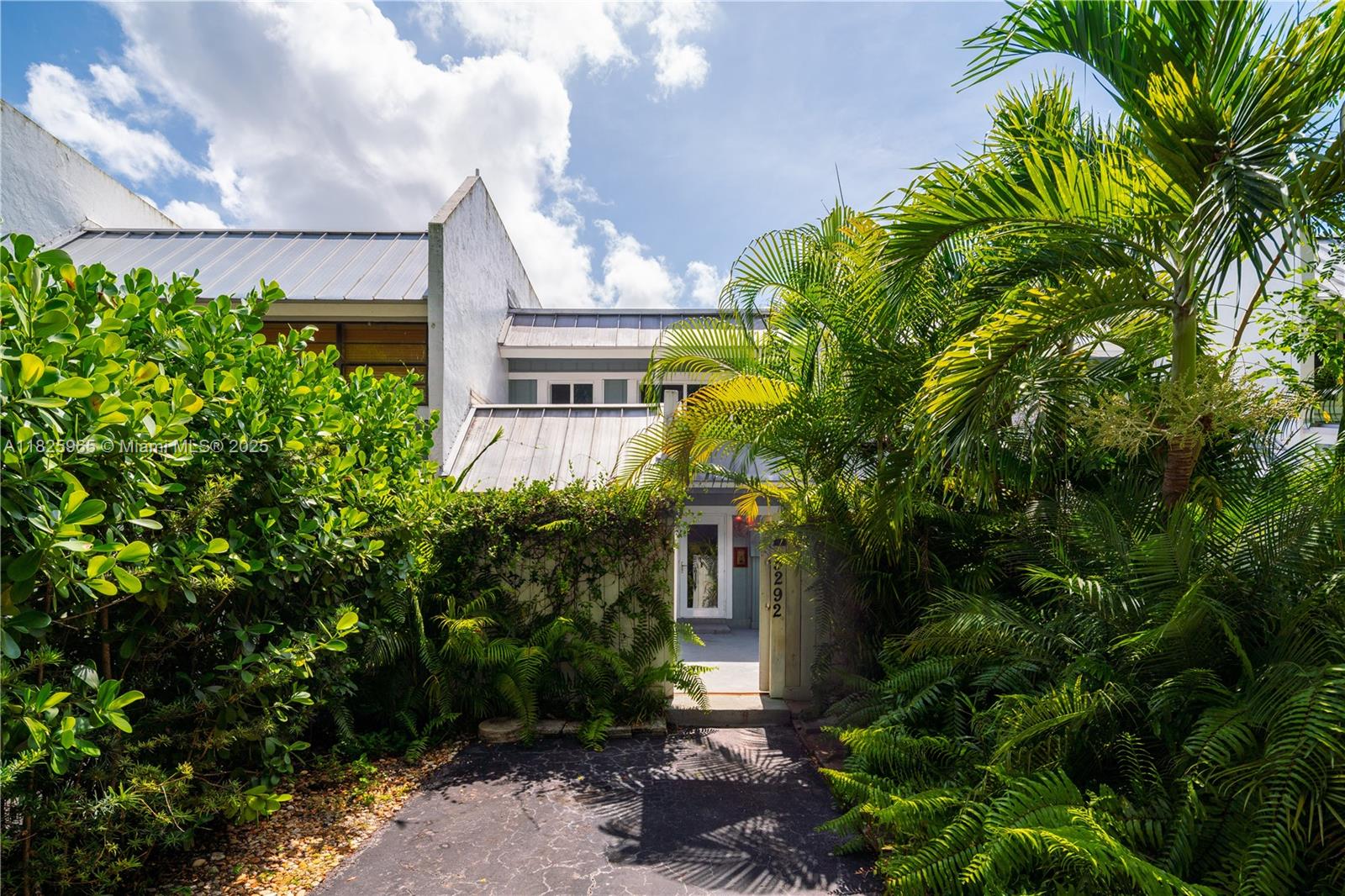 5292 Southwest 69th Place Miami, FL 33155 - Photo 6 of 37 a yellow building with trees in front of it