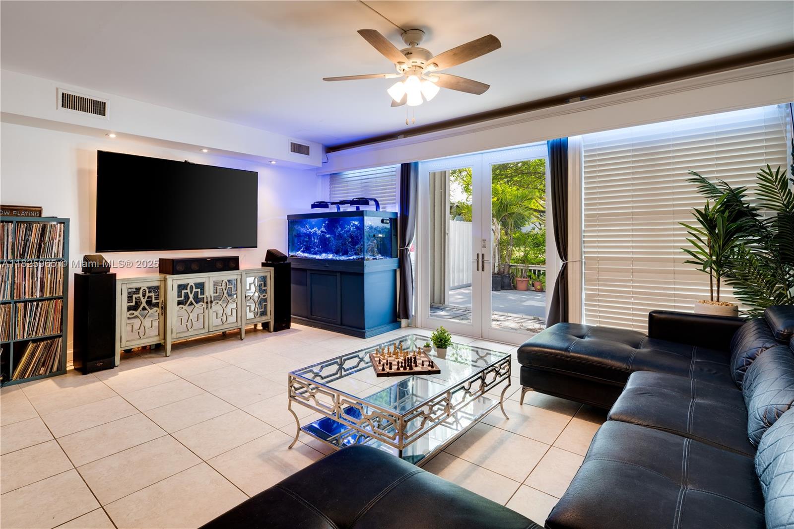 5292 Southwest 69th Place Miami, FL 33155 - Photo 9 of 37 a living room with furniture and a flat screen tv