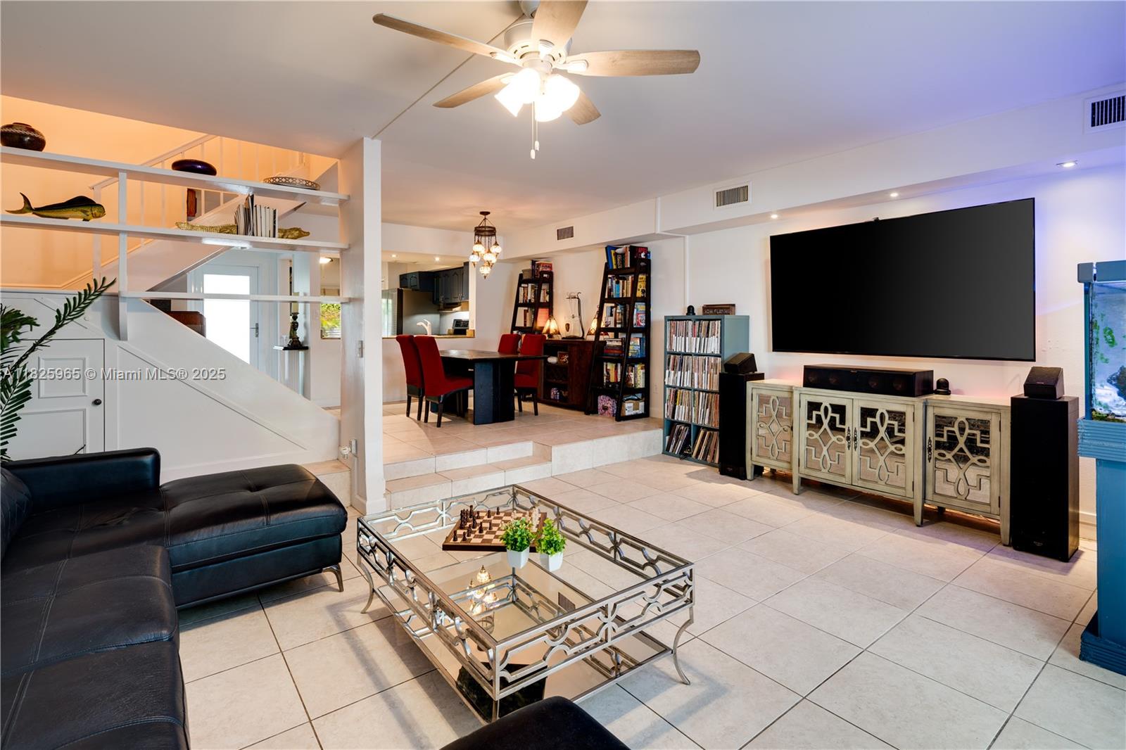 5292 Southwest 69th Place Miami, FL 33155 - Photo 10 of 37 a living room with furniture and a flat screen tv