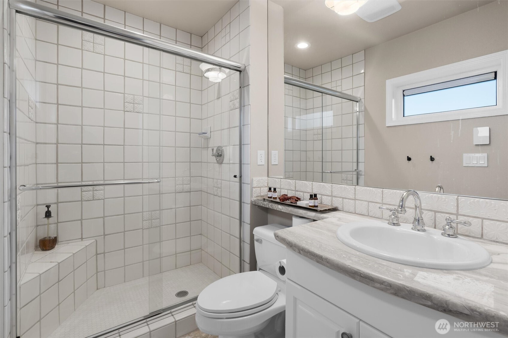 1005 Harbor Avenue Southwest, Unit 400 Seattle, WA 98116 - Photo 18 of 39 a bathroom with a sink toilet and shower