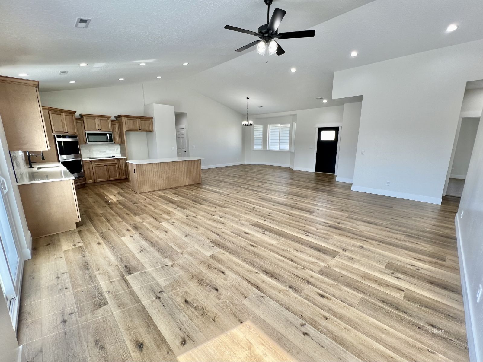 610 Ridgeway Drive Spring Creek, NV 89815 - Photo 10 of 33 a view of a living room a dining room wooden floor and a window