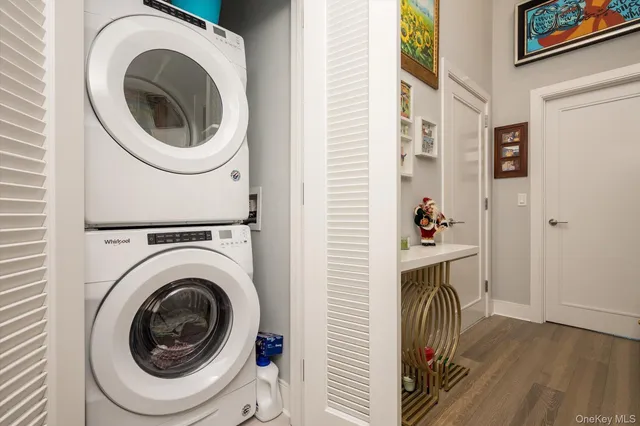 a view of a hallway with washer and dryer