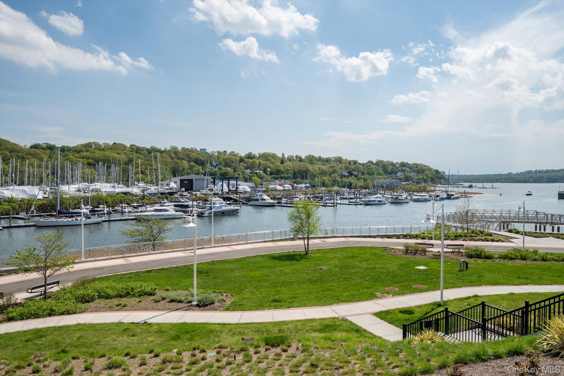 100 Garvies Point Road, Unit 1042 Glen Cove, NY 11542 - Photo 20 of 33 Water view with a marina and fence