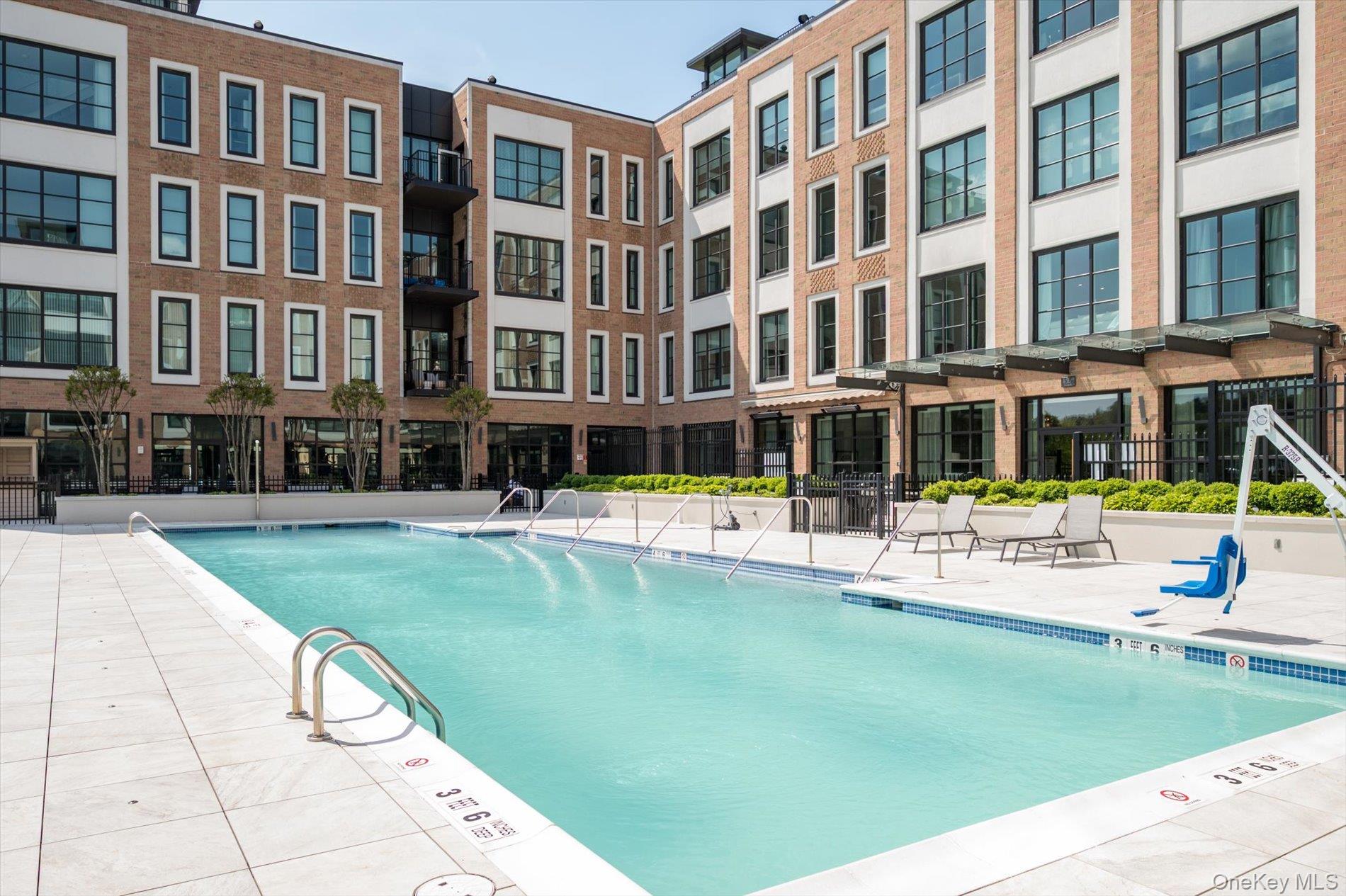 100 Garvies Point Road, Unit 1042 Glen Cove, NY 11542 - Photo 24 of 33 Community pool featuring fence