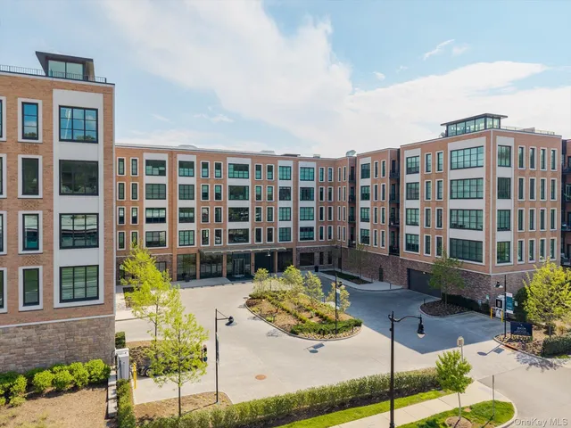 a front view of building with a garden