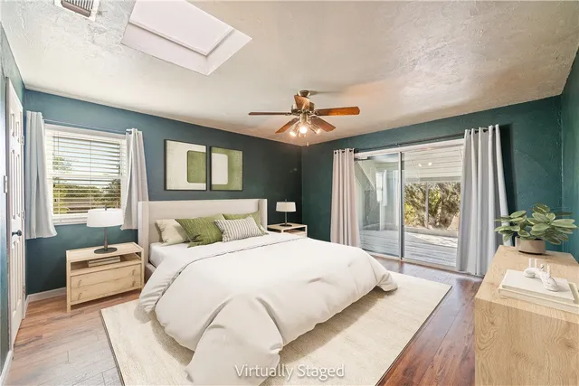 a bathroom with a sink a large mirror and a bathtub
