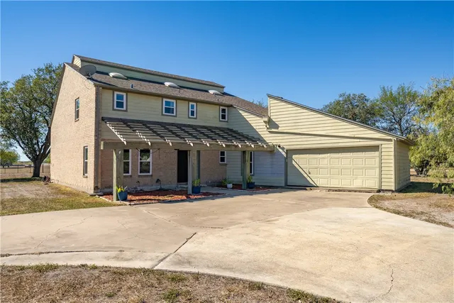 a front view of a house with a pathway