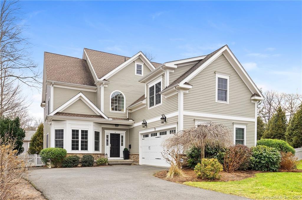 4 Colony Road West Hartford, CT 06117 - Photo 1 of 1 a front view of a house with a yard and potted plants