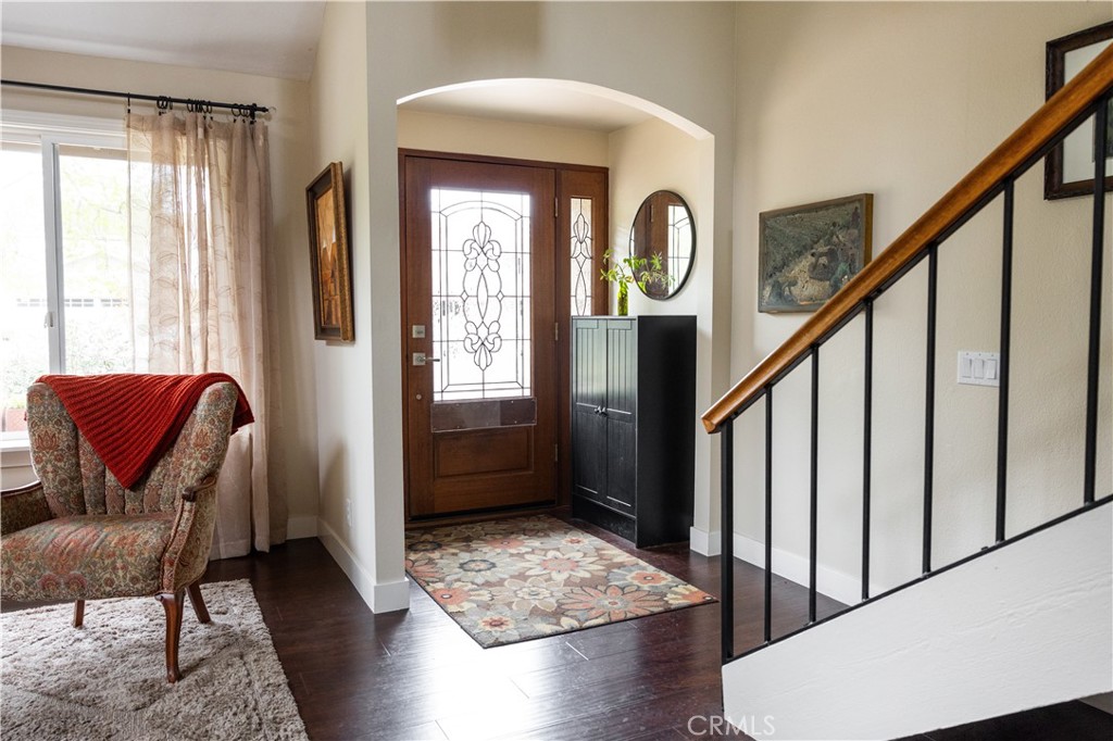 26251 Brookhollow Lake Forest, CA 92630 - Photo 11 of 27 a view of hall way with furniture and staircase with wooden floor