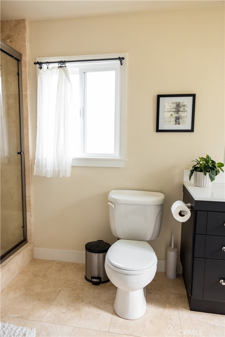 26251 Brookhollow Lake Forest, CA 92630 - Photo 14 of 27 a bathroom with a toilet a sink and a window
