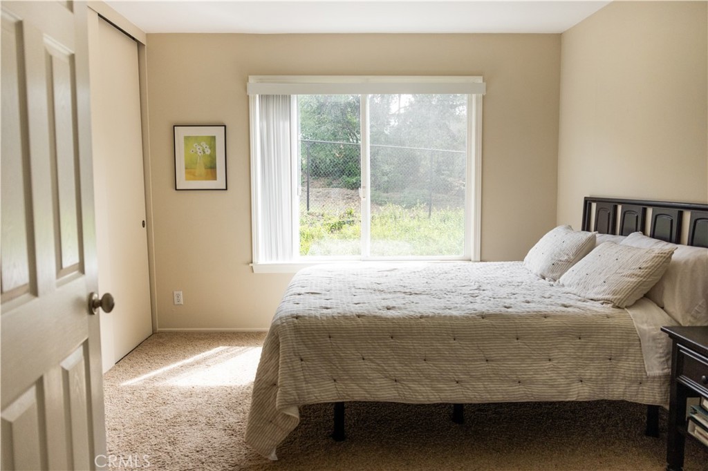 26251 Brookhollow Lake Forest, CA 92630 - Photo 17 of 27 a bedroom with a bed and a window
