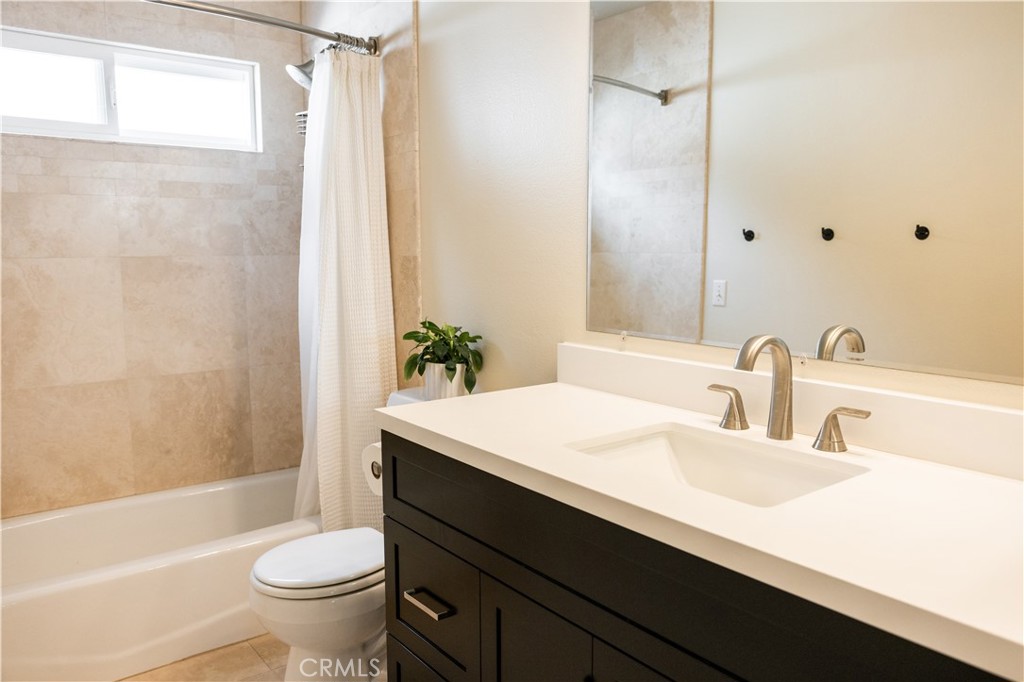 26251 Brookhollow Lake Forest, CA 92630 - Photo 19 of 27 a bathroom with a sink toilet and shower